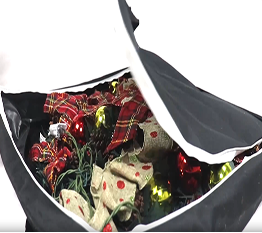 Black bag with Christmas-themed items including wrapped gifts and decorative ribbons.